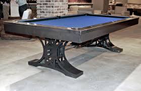 A new pool table with blue felt for sale in the North Coast Pool Tables showroom